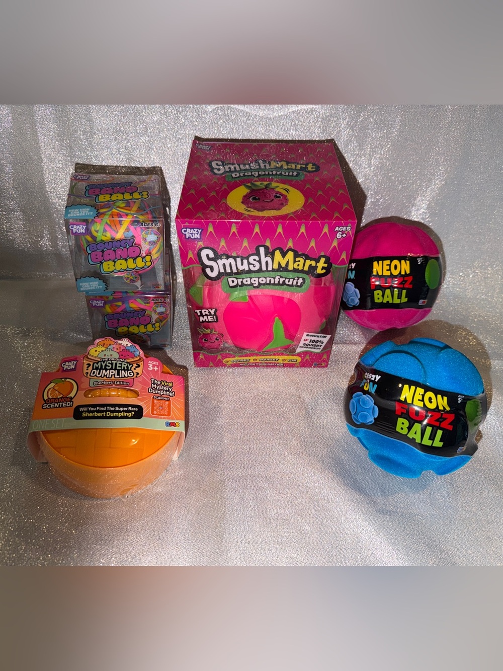 1  Scented Orange Squishy Dumpling, 1 Squishy DragonFruit & 2 Fuzz & Band Balls